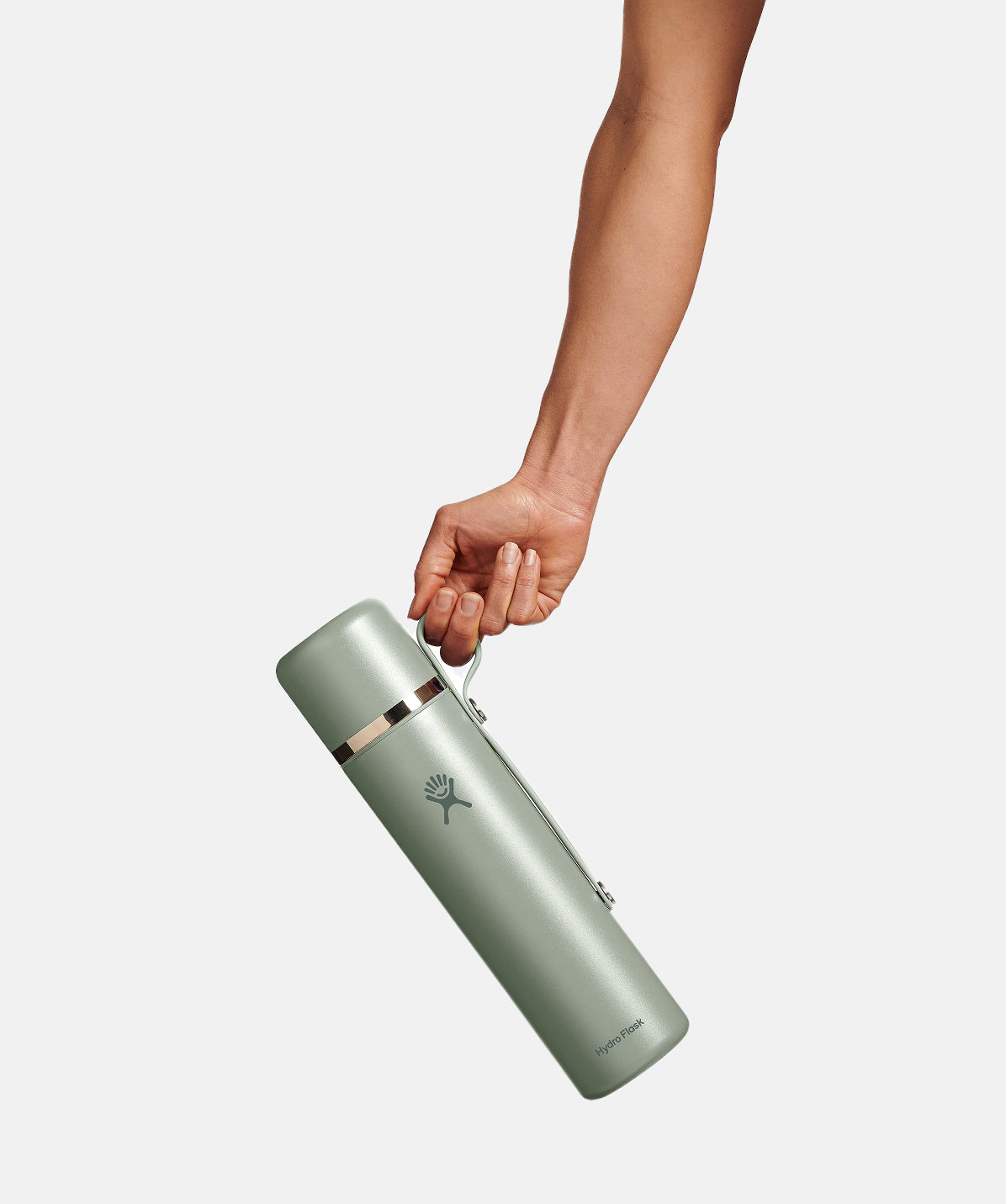 Termo Hydro Flask 36oz Agave, sujetado con la mano, aislamiento TempShield de doble pared.